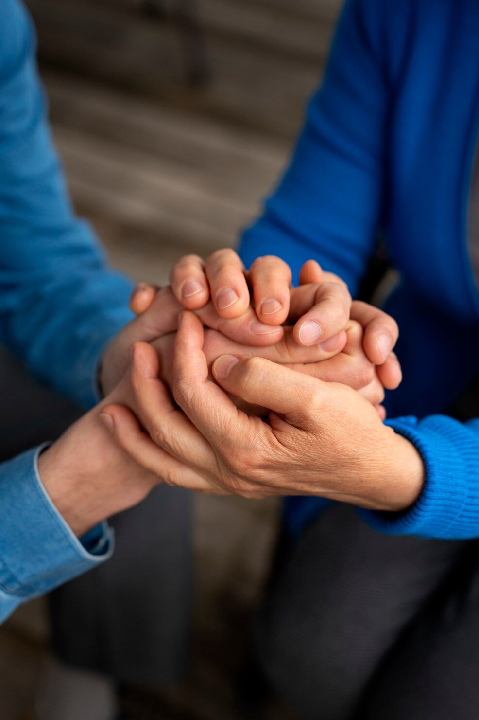 Two 1 Care Connect team members talking warmly in a bright office