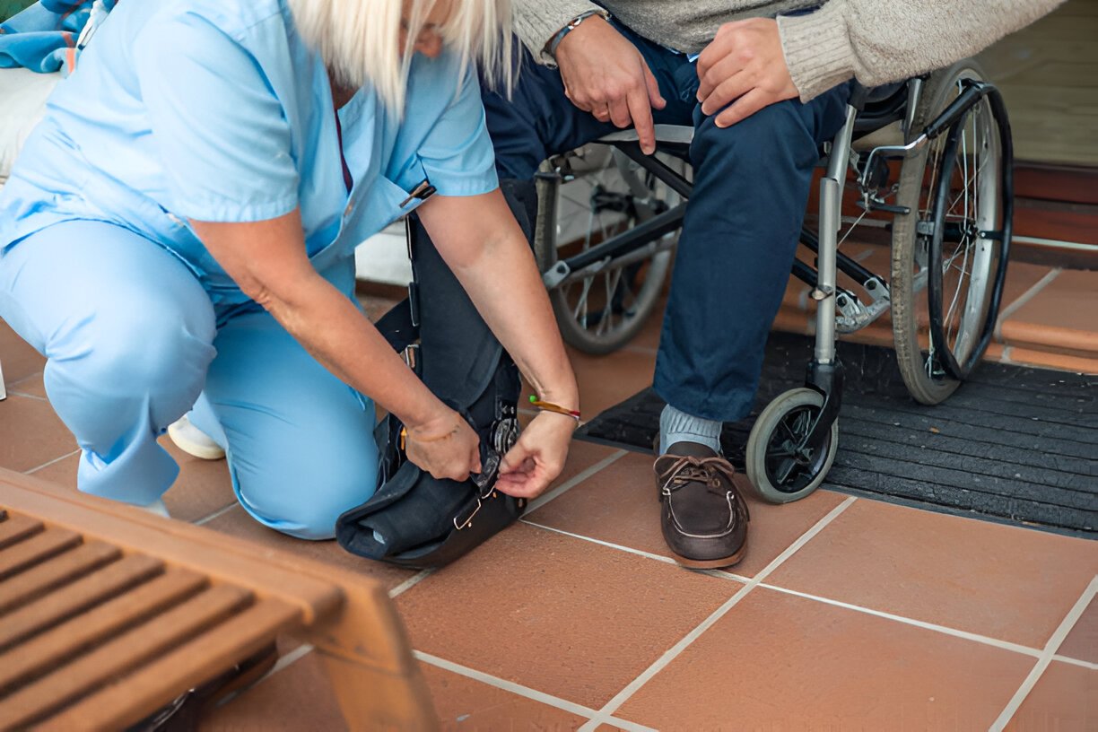 A registered nurse caring for an older participant at home