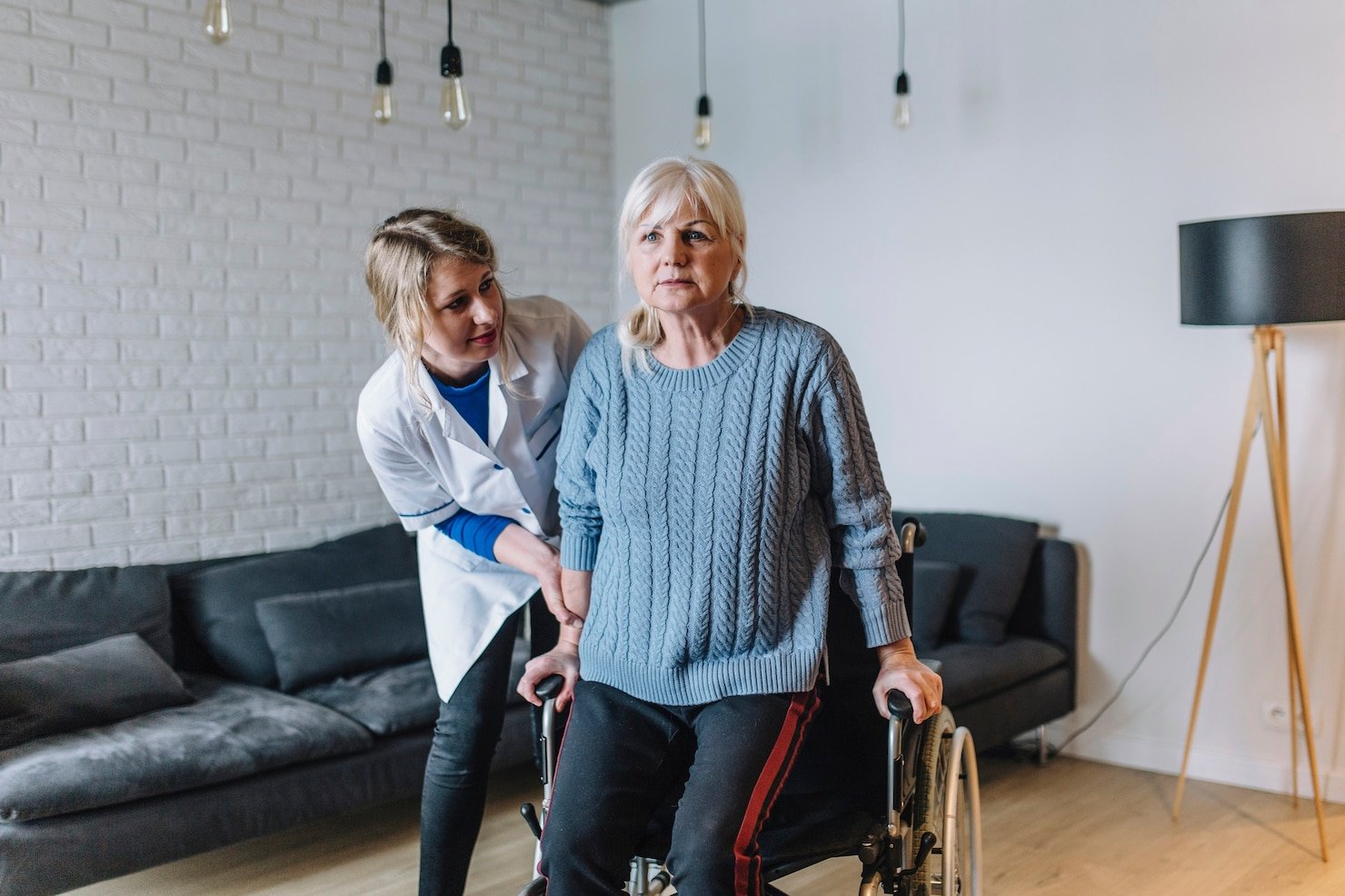 A carer supporting a participant with warmth and dignity